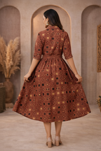 Back view of brown patterned dress