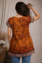 Back view of orange tie-dye tunic top