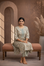Beige floral kurti seated pose
