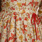 Close-up floral print and drawstring detail