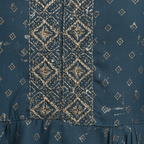 Close-up gold embroidery and print detail