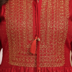 Close-up gold embroidery and print detail