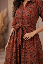 Close-up of dress fabric, collar and belt detail