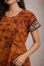 Close-up of tie-dye pattern and decorative trim