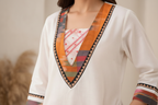 Neckline and trim detail close-up
