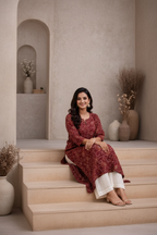 Seated pose in maroon printed kurti with palazzo