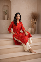 Seated pose in red printed kurti with palazzo