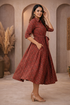 Side view of red medallion patterned dress