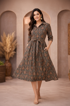 Walking pose in brown paisley patterned dress