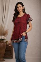 Walking pose in maroon tie-dye tunic top