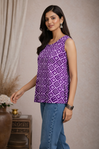 Walking pose in purple geometric patterned top