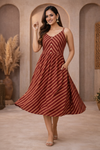 Walking pose in red diagonal striped dress