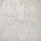 White embroidery detail close-up