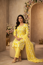 Yellow floral kurti seated pose